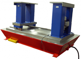 The stationary riser is shown assembled onto the base plate. The moving riser is assembled onto the slide saddle and the scissors lift is shown fully down.