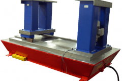 The stationary riser is shown assembled onto the base plate. The moving riser is assembled onto the slide saddle and the scissors lift is shown fully down.