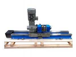 Side view showing MB65 block spindle with 7.5 hp Nord gearmotor mounted on HHW15 hardened way slide with 86” long base, 29” long saddle, servo motor mount, one shot lubricator and two limit switches.