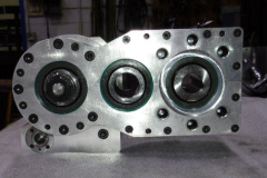 Gear box with manual draw bar at left, idler gear in center and motor mount at right