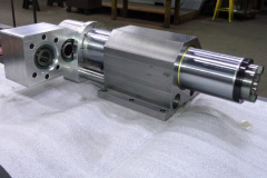 Gear box at left with alternate motor mount shown. Guide rod and quill clamp housing in center and spindle nose at right