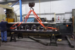 We surface ground the ways of this Mazak Powermaster Lathe Bed to ± .0002” over 172.5” on our Favretto TU600 surface grinder in the background.