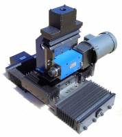 MB275/LBW8/LBW8/LBW12: one spindle and three axis slide assembly with linear ball bearings, ground ball screws and motor mounts. Used to mill a chamfer on an aluminum part.