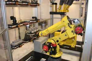 M20iA shown picking a part using Hirschmann Pallet System.